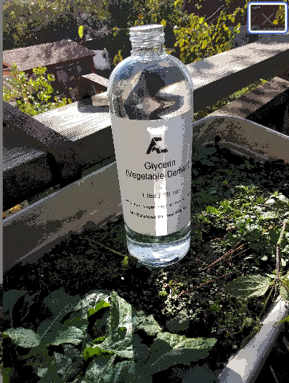 glycerin bottle in garden setting